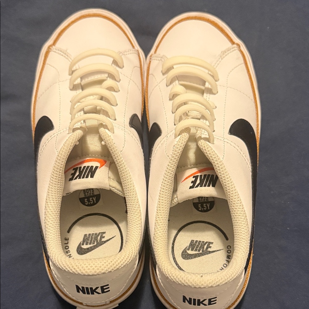 Boys 5.5, Women 8 - Nike White & Black Sneakers, fits women’s size 8 - Like New